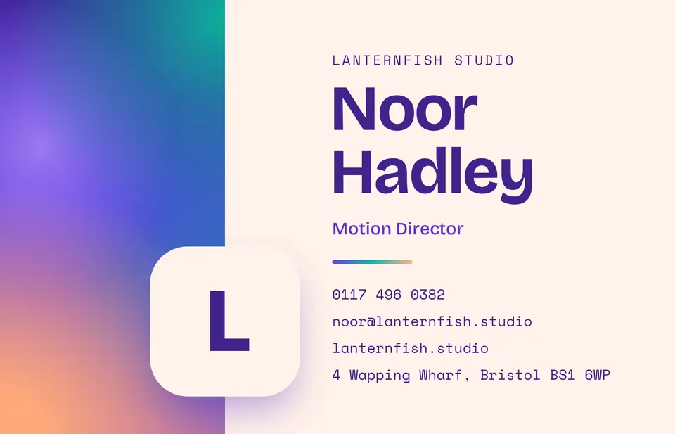 A landscape business card with a violet, teal and peach aurora gradient down the left edge, a cream rounded badge holding the letter L, and the name Noor Hadley in large deep violet type for Lanternfish Studio.