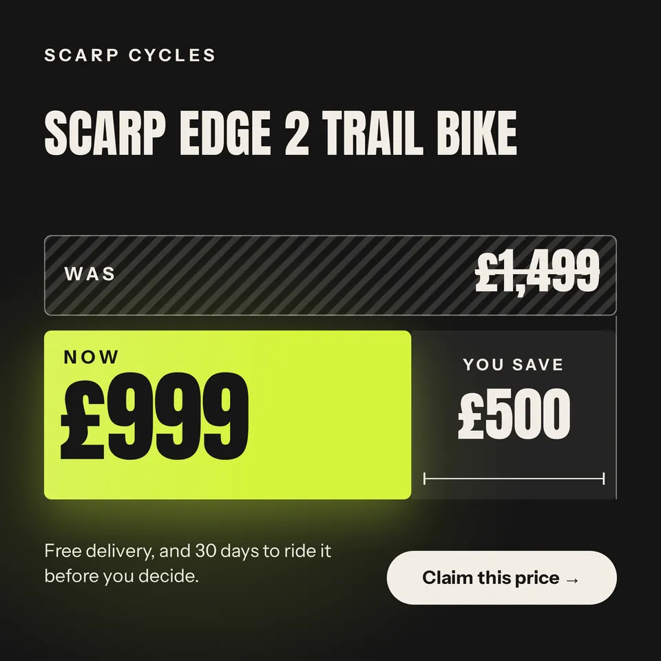 A square sale price ad for the Scarp Edge 2 trail bike, drawn as two price bars: a long striped bar that was £1,499 and a short lime bar that is now £999, with the £500 you save in the gap.